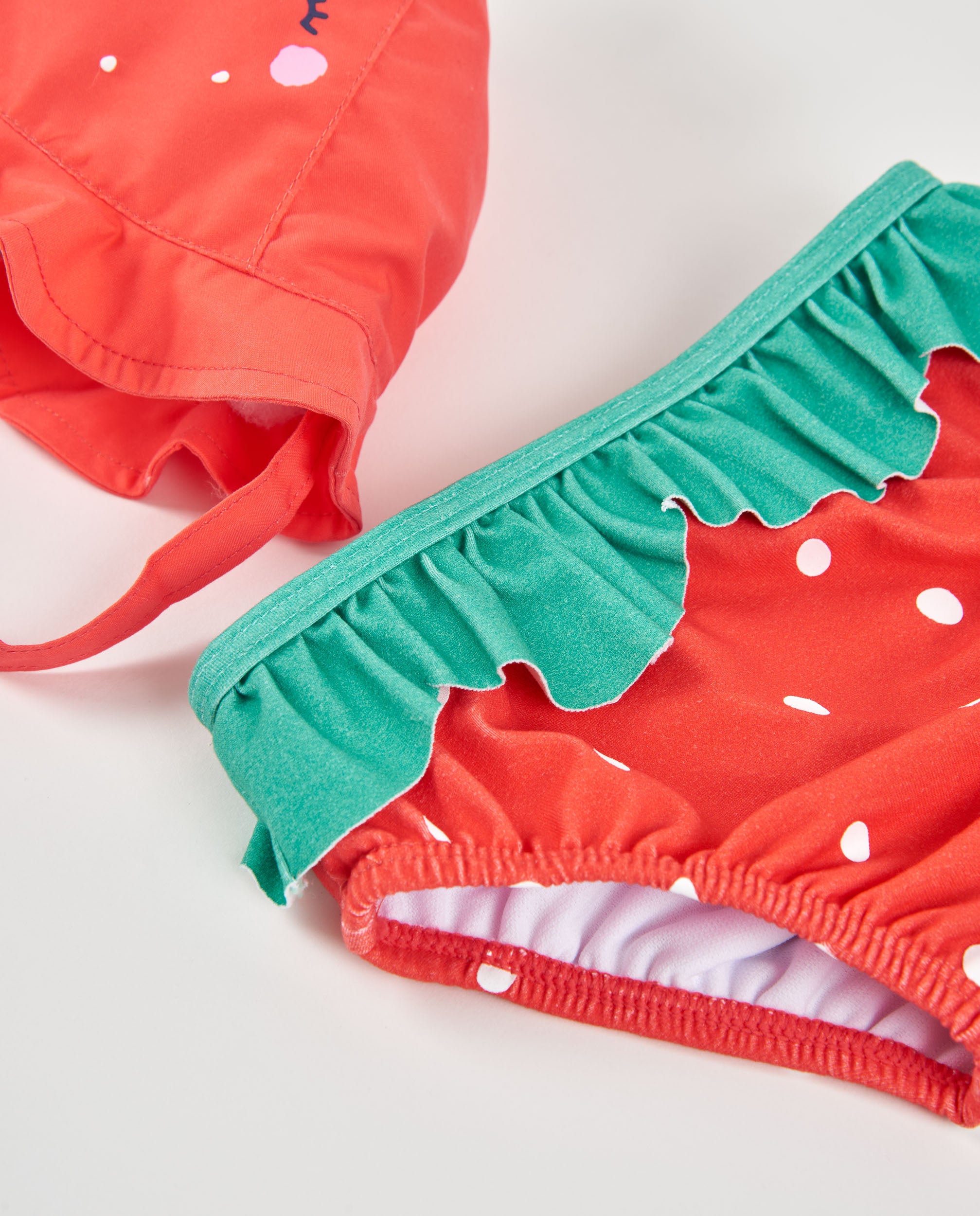 Tuc tuc costume neonata rosso fragola con cappello UPF50+