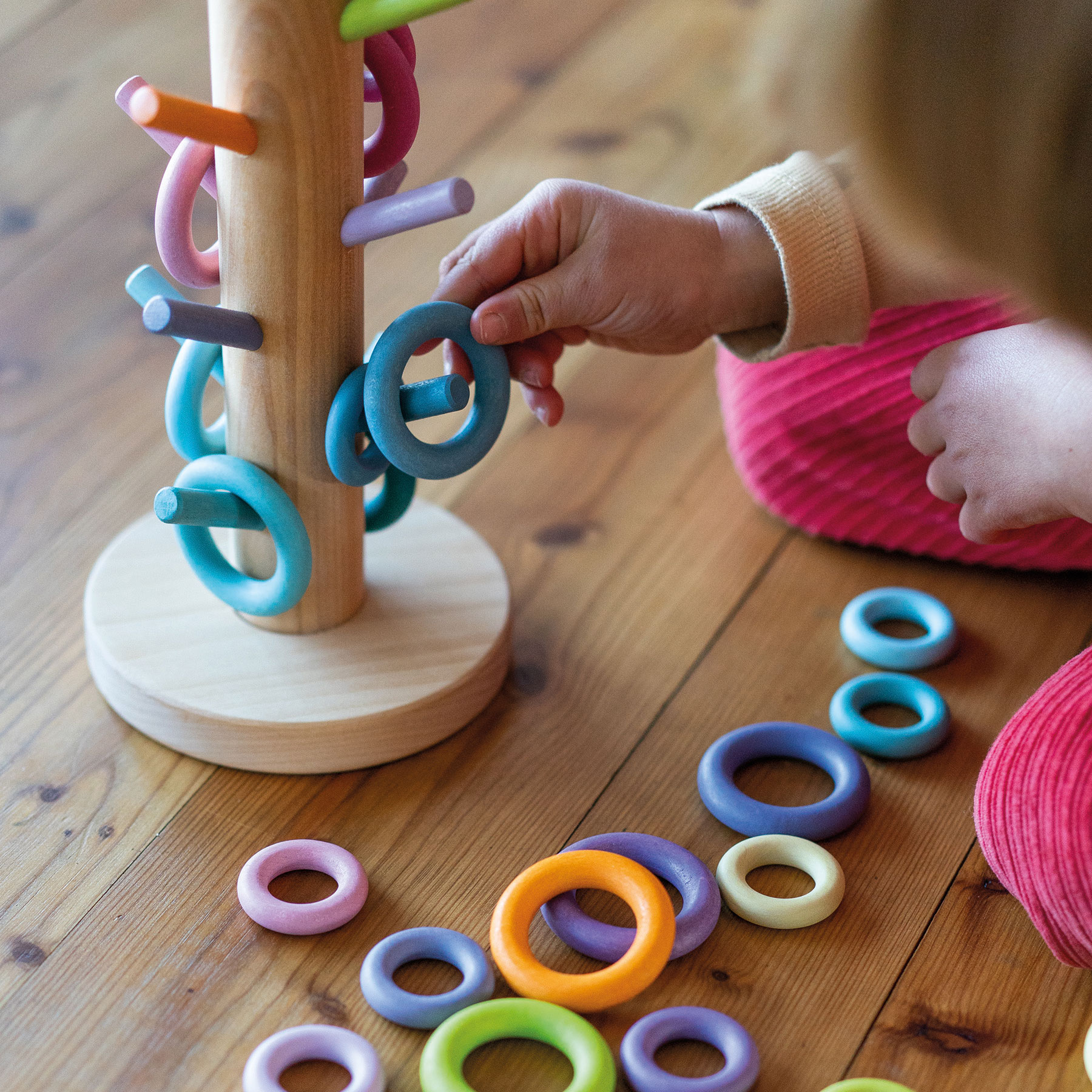Grimm's Building Rings Pastel albero in legno 12 tasselli