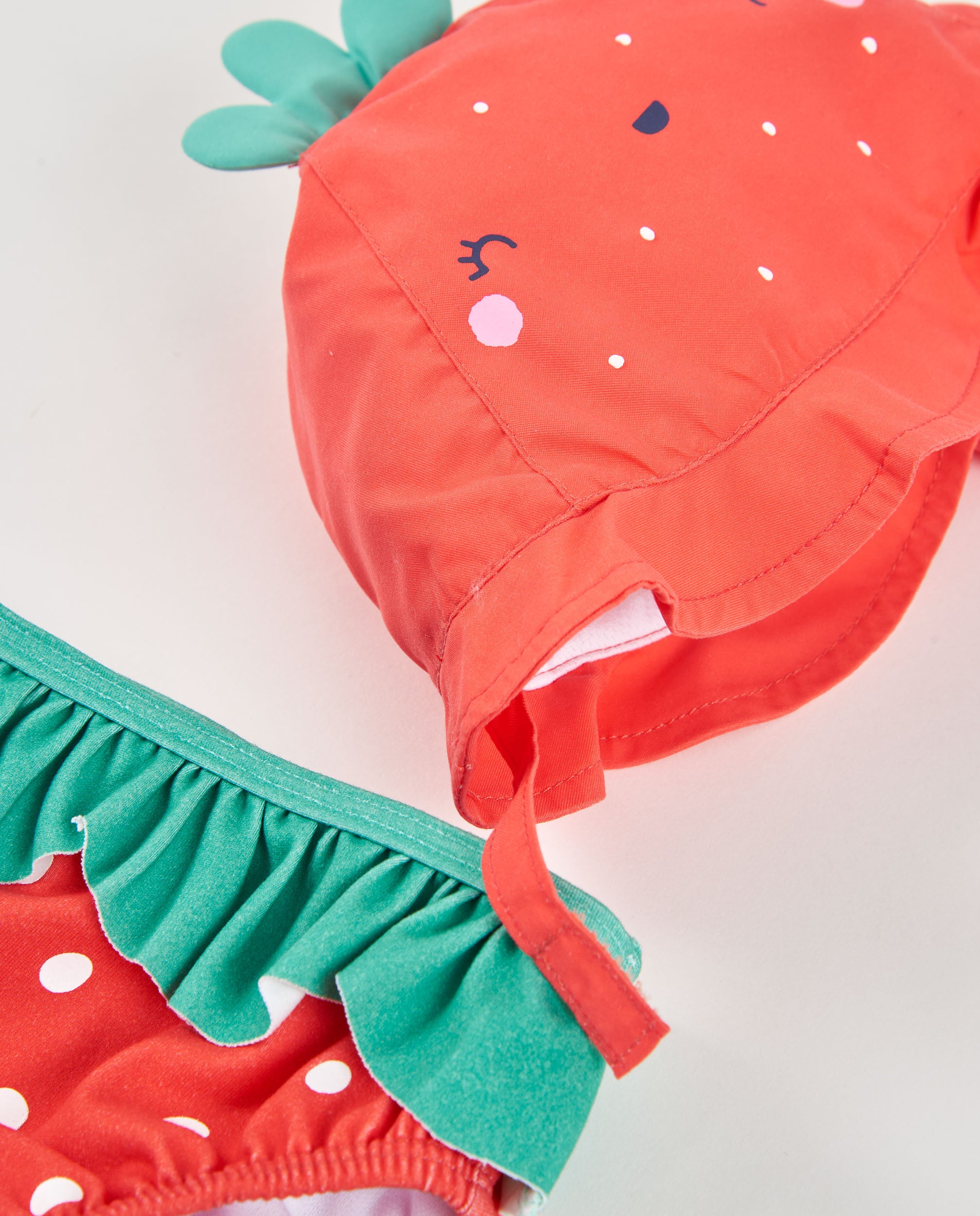 Tuc tuc costume neonata rosso fragola con cappello UPF50+