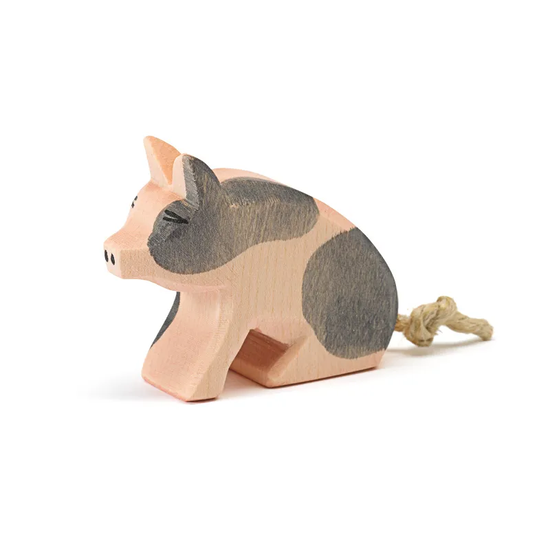 Ostheimer Maialino pezzato seduto figura legno 4,5 cm