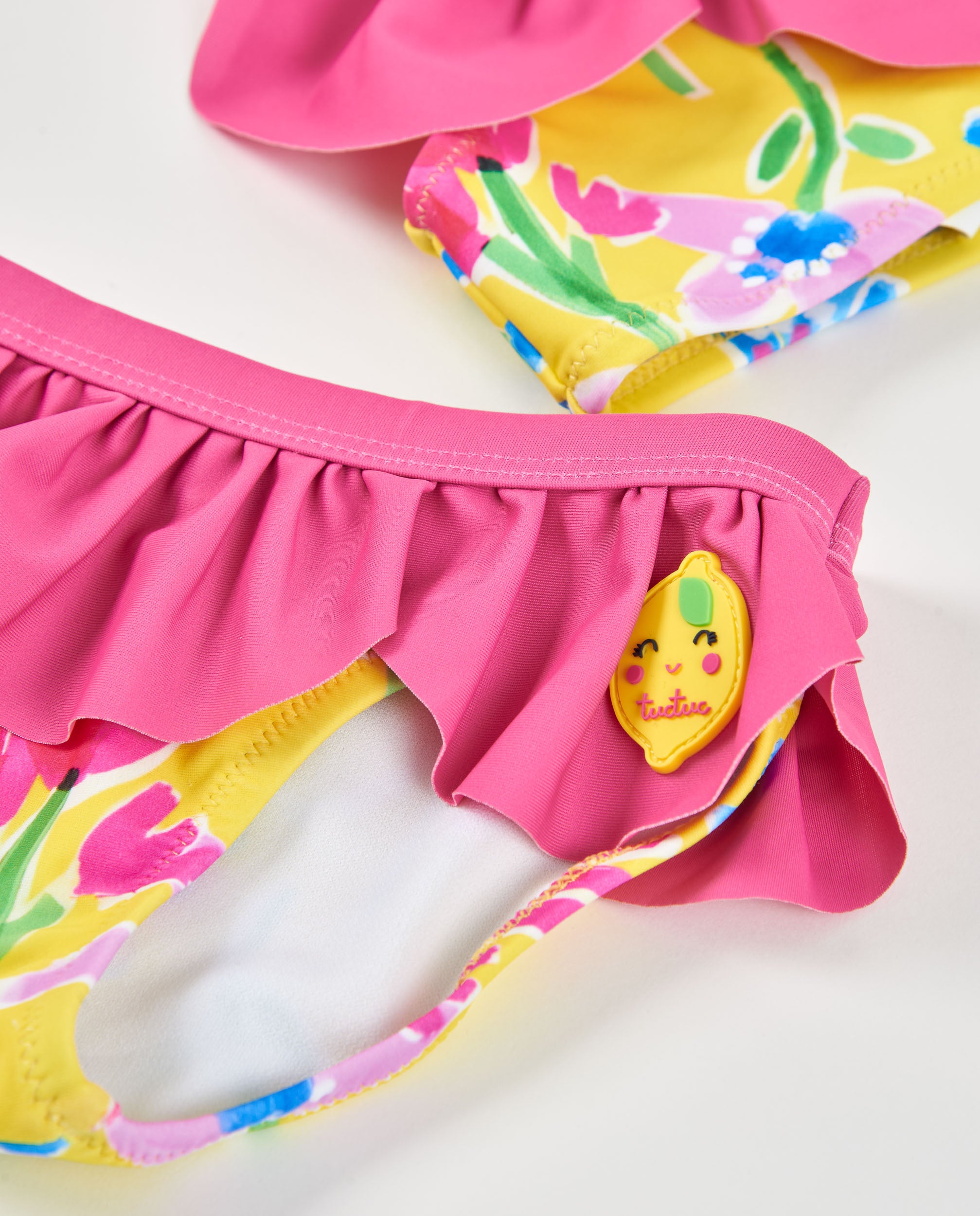 Tuc tuc bikini bambina giallo con volant rosa