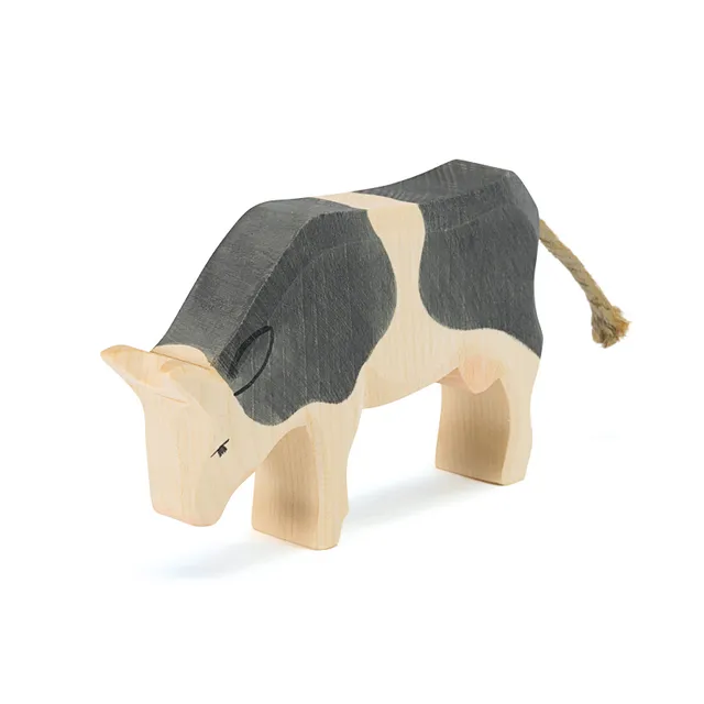 Ostheimer Mucca pezzata che mangia figura legno 11,5 cm