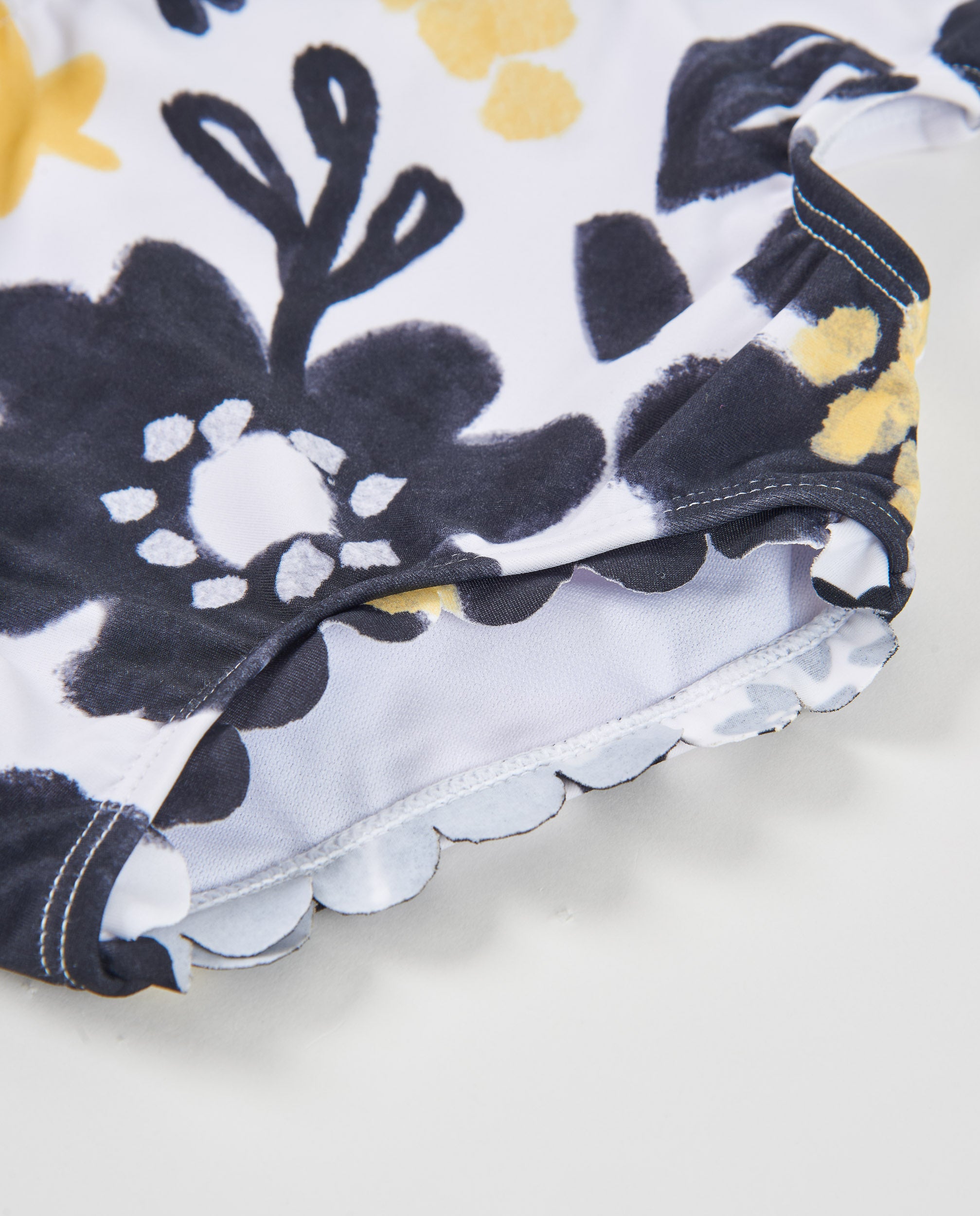 Tuc Tuc costume intero bimba bianco fiori nero